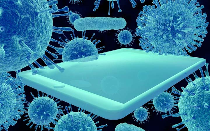 smartphone surrounded by microscopic germ particles