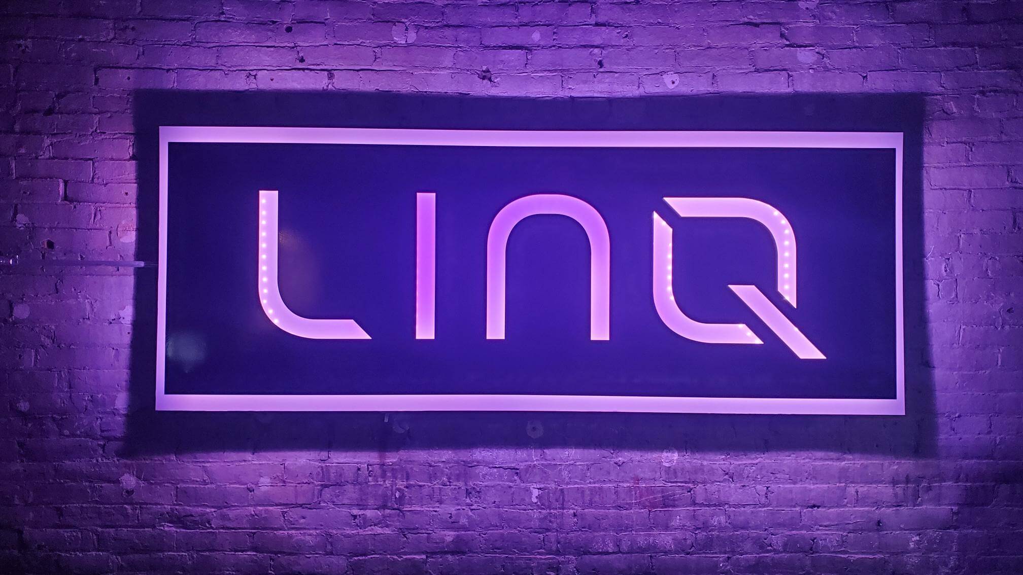 a neon LINQ sign
