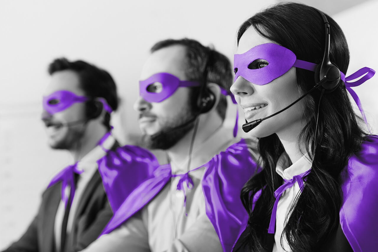 Line of customer care employees wearing masks and capes